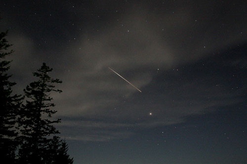ISS skirting the clouds on it's long journey by Richard Glenn