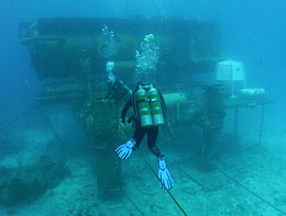 NASA image of a diver approaching the Aquaroin undersea loboratory