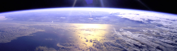 The Sun reflects off the Earth's vast, blue oceans in this stunning image captured by the space shuttle