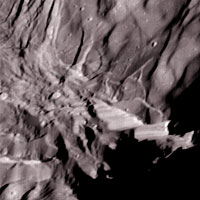 Voyager 2 close-up of Miranda showing steep cliffs