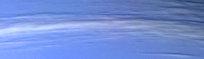 This Voyager 2 close-up of Neptune shows upper level clouds in the atmosphere