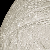 Cassini close-up of Tethys showing cliffs of Ithaca Chasma 