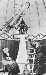 Maria Mitchell seated at  the Vassar College Observatory with a student
