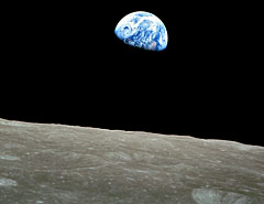 Image of the earth rising above the surface of the Moon during Apollo 8