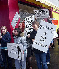 Image of a mock protest in support of the planet Pluto