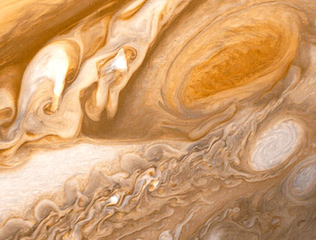 Close-up image of Jupiter captured by NASA's Voyager 1 spacecraft showing the great red spot and other storms