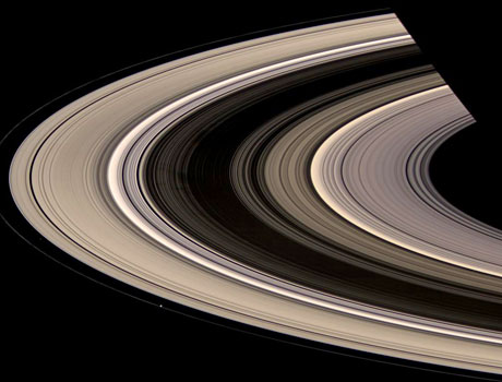 Image of Saturn's rings captured by NASA's Cassini spacecraft, showing the tiny moon Prometheus