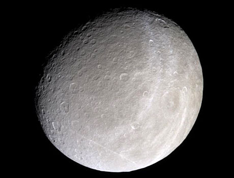 Image of Saturn's moon Rhea captured by NASA's Cassini spacecraft showing the moon in natural color
