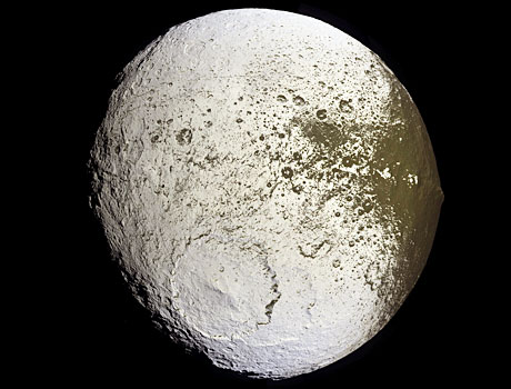 Image of Saturn's moon Iapetus captured by NASA's Cassini spacecraft, showing the contrast between its light and dark features