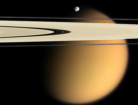 Image taken by NASA's Cassini spacecraft showing Saturn's moons Epimetheus and Titan among the planet's rings