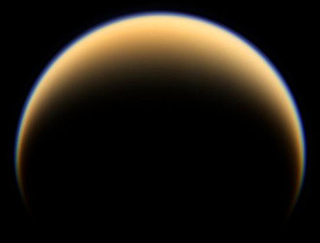 Image of Saturn's giant moon Titan as seen by NASA's Cassini spacecraft, showing the thick, yellow-orange atmosphere