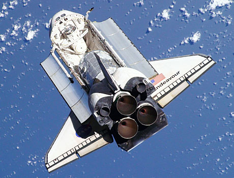 STS-130 image of the Space Shuttle Endeavour in orbit above the Earth